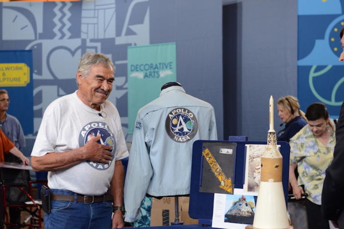 An older man getting NASA memorabilia appraised at the Antiques Roadshow.