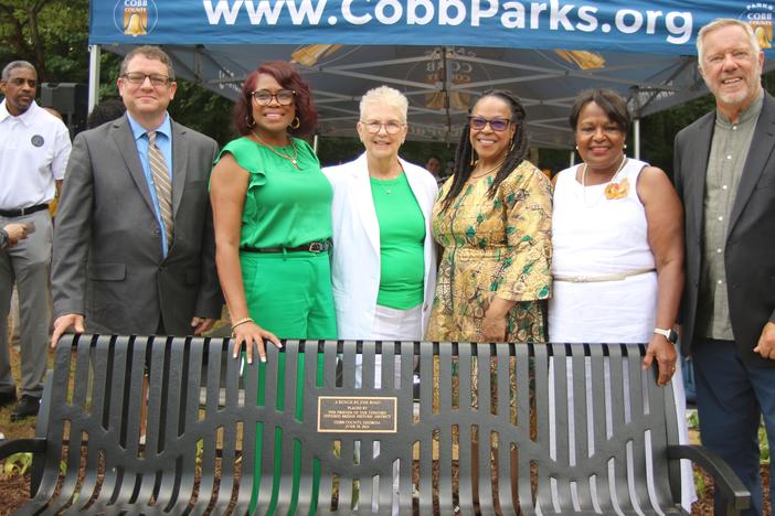 Cobb County Community Members posed for pictures in front of the bench honoring the legacy of historic African American author, Toni Morrison, and a former enslaved family of a mother and three children. (Friends of the Concord Bridge)