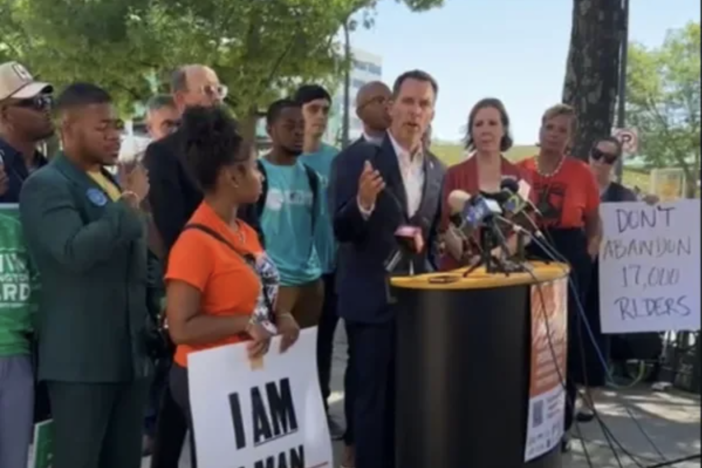 Atlanta City Council President Doug Shipman asks MARTA to pause its renovation of Five Points Station during a rally on June 25.