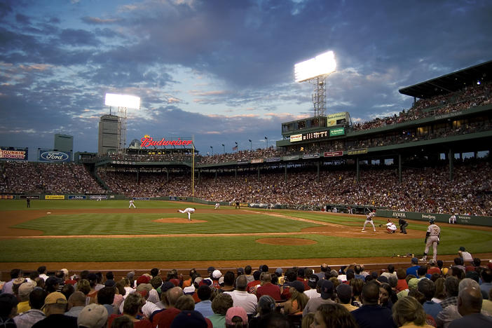 Red Sox pitcher Curt Schilling delivers a pitch at Fenway Park in 2006.