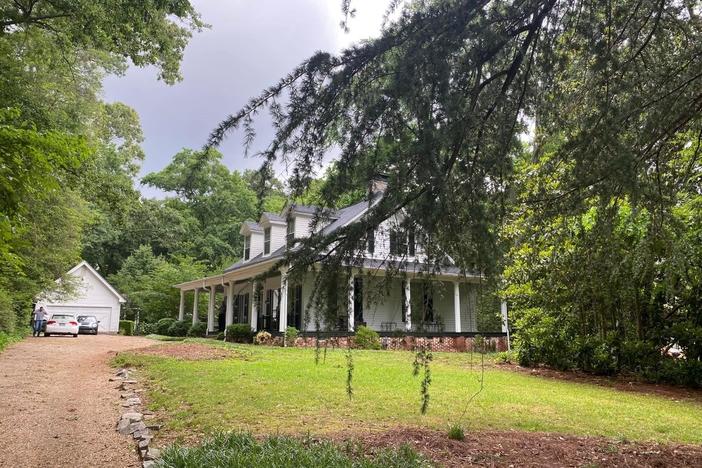 There is so much to see in Charlie Harrison's home: folk art, golf memorabilia, antiques, artifacts, books, and fixtures more than a century old.