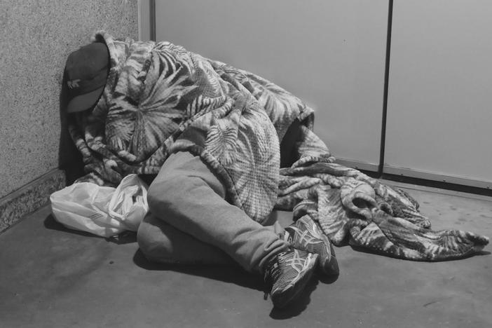 Unhoused man asleep