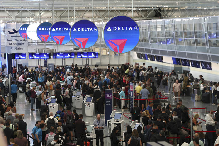 Delayed travelers wait in lines at Minneapolis-St. Paul International Airport after software issues delayed flights globally, July. 19, 2024, in Minneapolis.
