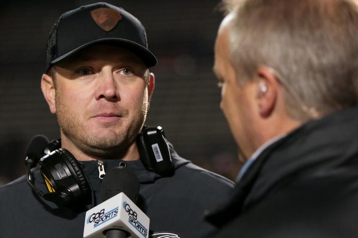 Milton head coach Ben Reeves and GPB Sports' Jon Nelson during a 2024 game.
