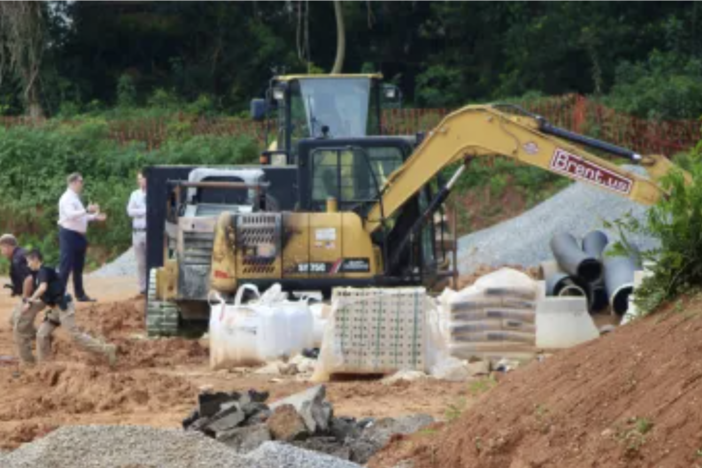 A black burn mark can be seen on an excavator at a townhome development site on Memorial Drive in Kirkwood. Atlanta Police say they believe suspected arsonists are opponents of the public safety training center, also known as ‘Cop City.’ 