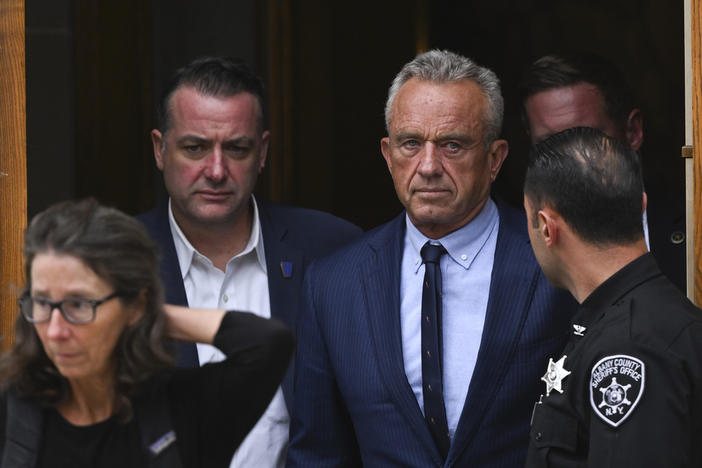  Independent presidential candidate Robert F. Kennedy Jr., center right, leaves the Albany County Courthouse, Aug. 6, 2024, in Albany, N.Y. 