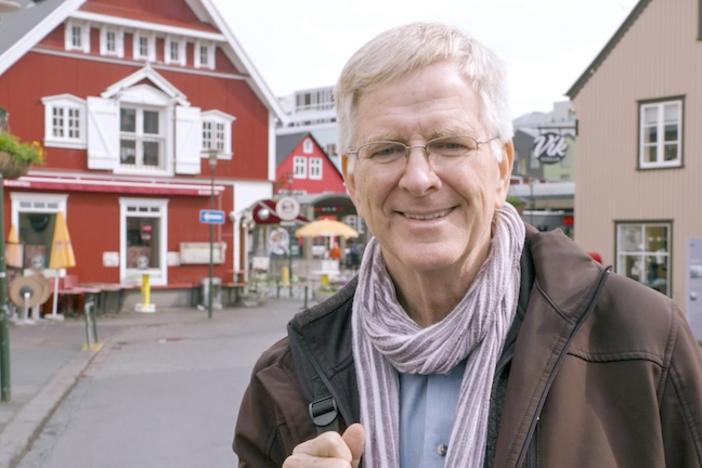Rick Steves standing on a street in Iceland