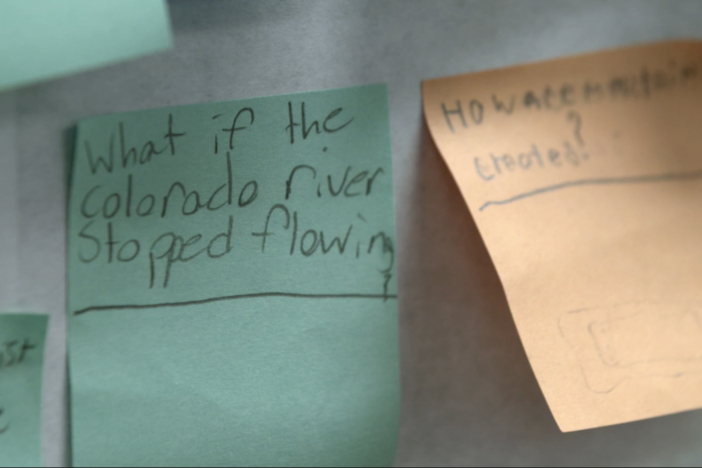 Students generate driving questions on sticky notes