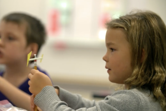 Students perform science experiment