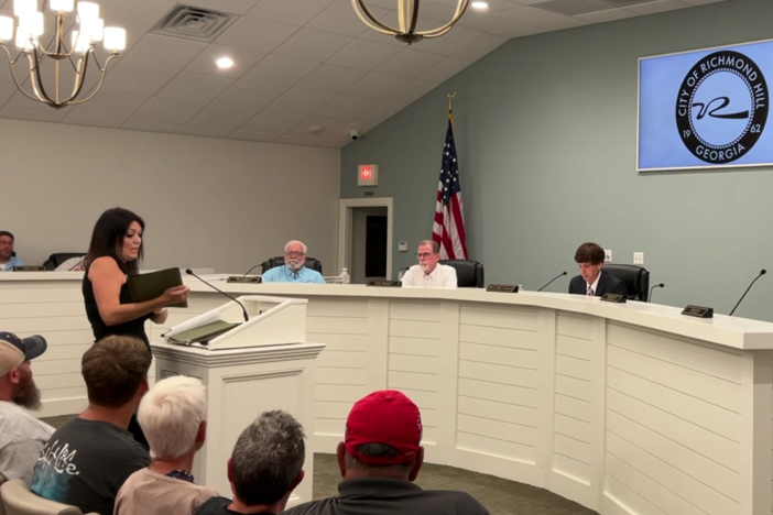 Richmond Hill resident Kristina Fredericks addresses the Richmond Hill City Council on Aug. 20, 2024, about flooding damage to her home and yard after Tropical Storm Debby.