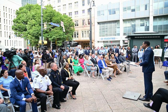 Mayor Andre Dickens speaks at an event in Woodruff Park on Sept. 8, 2024 to announce $60 million in public funds for affordable housing.