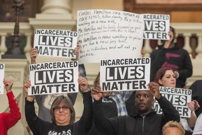 Family members of people incarcerated in Georgia prisons and others protest against lax prison safety during a trip to the Georgia Capitol in 2023. 