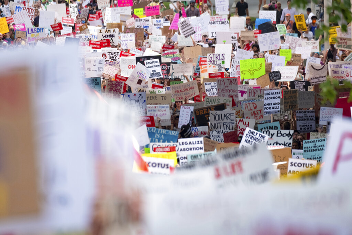 People march through Downtown Atlanta on Friday, June 24, 2022, to protest the Supreme Court's decision to overturn Roe v. Wade.  The Supreme Court on Friday stripped away women’s constitutional protections for abortion, a fundamental and deeply personal change for Americans' lives after nearly a half-century under Roe v. Wade. The court’s overturning of the landmark court ruling is likely to lead to abortion bans in roughly half the states.
