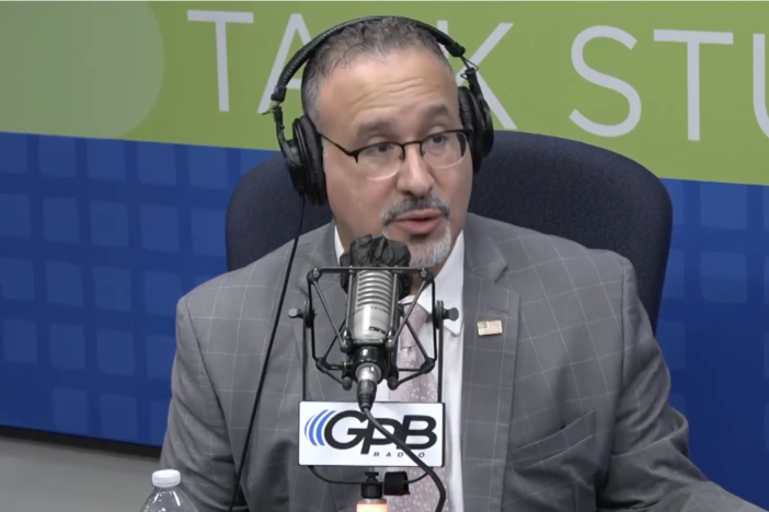 U.S. Secretary of Education Miguel Cardona speaks with Peter Biello at the GPB Studios on Oct. 17, 2024.