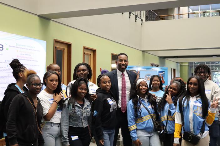 Atlanta Mayor Andre Dickens pictured with Atlanta Public School girl students ahead of the City of Atlanta’s first International Day of the Girl celebration on October 11, 2024. Ambria Burton/GPB News