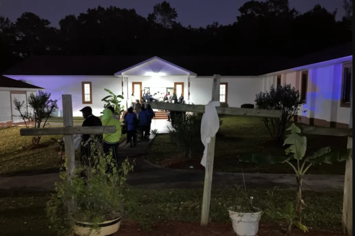 People enter building on Sapelo Island following dock collapse
