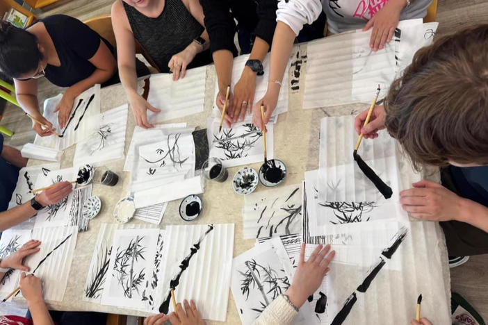 Calligraphy class inside Maomi Bookstore.
