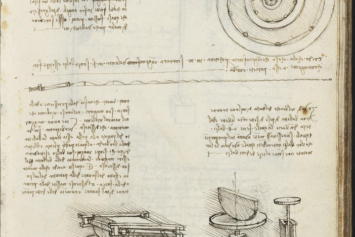 yellowed paper with sketches, including a spiral, and text written in Italian