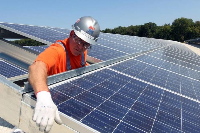 Keith Plume of PayneCrest Electric Company checks that solar panels are lined up correctly at the Ameren O’Fallon Renewable Energy Center in O’Fallon, Missouri on Sept. 18, 2014. Georgia is among the nation’s leaders for solar manufacturing this year. Bill Greenblatt UPI
