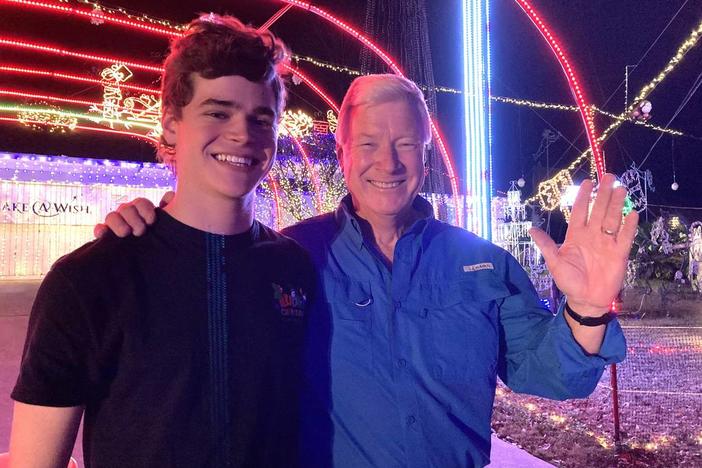 Foster Lambertus, left, and Jerry Ludy pose for a photo in 2021 at Ludy’s Christmas Lights Spectacular in Columbus. Courtesy of Foster Lambertus  