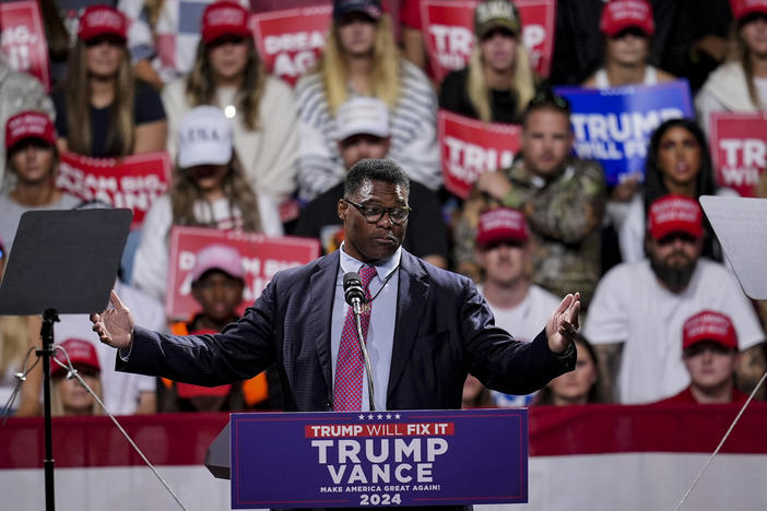 Herschel Walker speaks during a campaign rally at Atrium Health Amphitheater for Republican presidential nominee former President Donald Trump, Nov. 3, 2024, in Macon, Ga. 