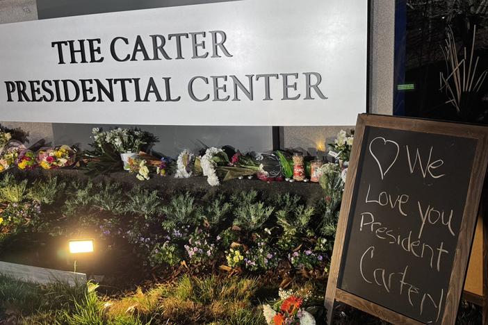 Flowers are laid at the entrance to the Carter Center in memory of Jimmy Carter, the 39th President of the United States who died on Dec. 29, 2024 at age 100.