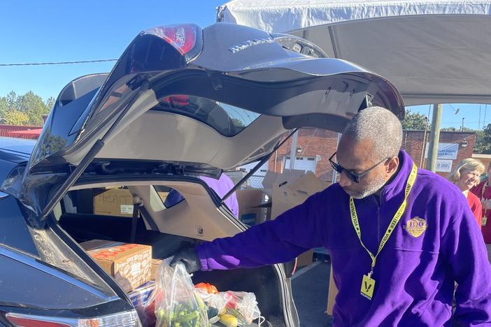 Caring For Others hosted its 24th annual food and household goods distribution event on Nov. 23 in Atlanta. The nonprofit distributed to several hundred families poultry, vegetables and other Thanksgiving fixings along with household goods like blankets and comforters. Photo from Caring For Others