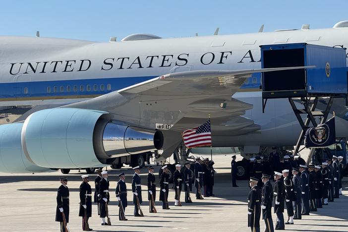Jimmy Carter's casket is lifted into the the body of Special Air Mission 39 at Dobbins Air Reserve Base in Marietta, Ga., on Jan. 7, 2025.