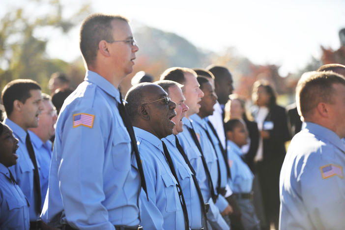Georgia Department of Corrections cadets and trainers before the 2010 ribbon cutting for the department's training facility and offices in Forsyth. A labor strike of the incarcerated would come about month later. GDC lost over 2,000 correctional officers in the following year.