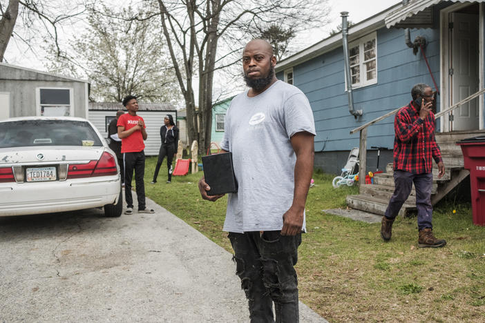 Carlos Ross holds the box containing the ashes of his son. Carmelo Ross was 15 when he was shot and killed. Carlos says he hasn't heard from homicide investigators for two years.