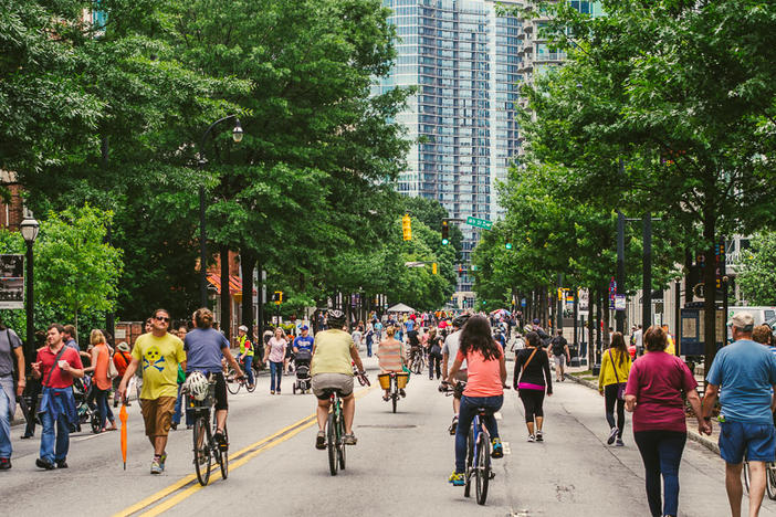 Bikers and pedestrians move down peachtree street during an Atlanta Streets Alive event