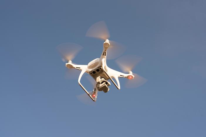 Low Angle Shot of Drone Flying in the Sky. Credit: Pexels