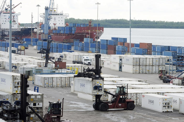 Dockworkers return to work at Port Miami, Oct. 4, 2024, in Miami, after the union representing 45,000 striking U.S. dockworkers at East and Gulf coast ports has reached a deal to suspend a three-day strike until Jan. 15 to provide time to negotiate a new contract. 
