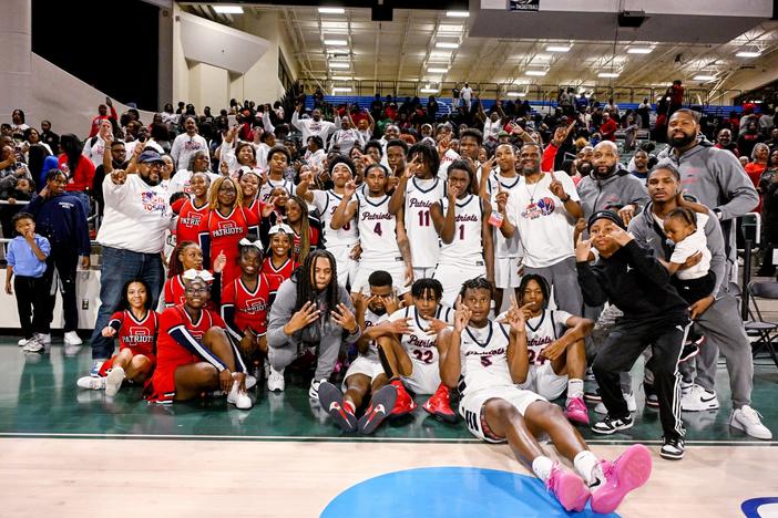 Southwest players and coaches celebrate with their fans after the Patriots’ 65-54 semifinal win over Toombs County. Southwest will play B.E.S.T. Academy for the state championship Saturday at the Macon Coliseum. Jason Vorhees / The Melody