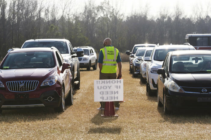 Public health workers manage a COVID-19 vaccination event in Cochran, Ga. on Jan. 25, 2021.