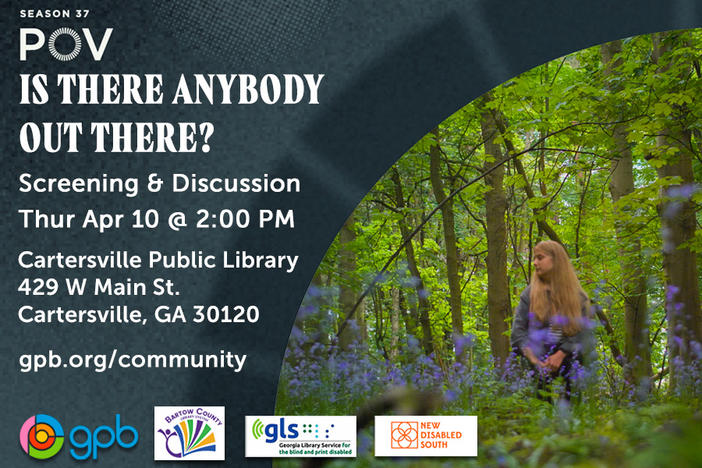 This image shows filmmaker Ella Glendining standing in a forrest among purple flowers as she looks to her right. It is the titular image for her documentary Is There Anybody Out There.