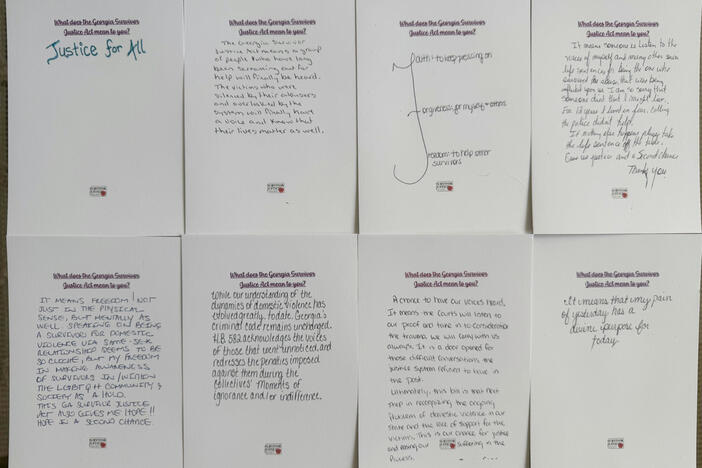 Cards written by domestic violence survivors who have been charged with crimes about the Georgia Survivor Justice Act taken are shown in Atlanta on March 28, 2025. 