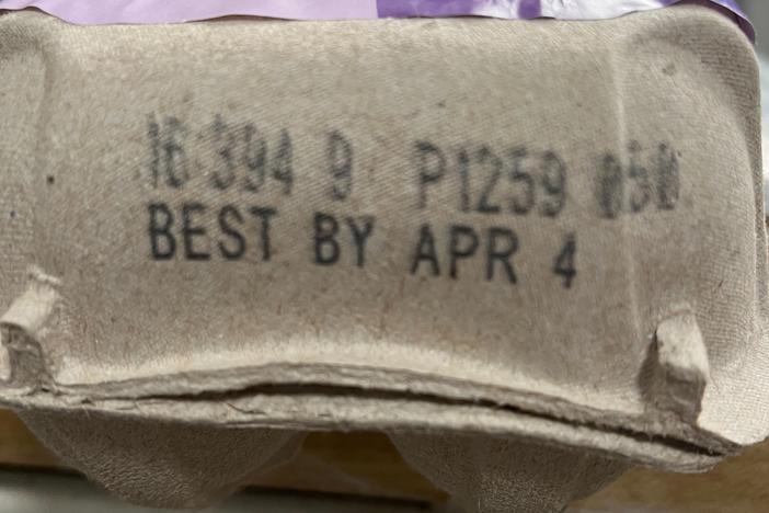 Close up of the "best by" date on a carton of eggs