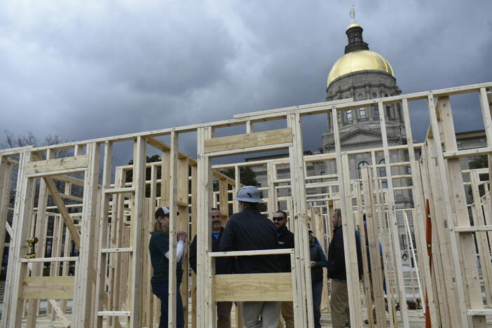 A coaltion of Georgia housing rights organizations descended outside the state capitol on the March 5 eve of a critical deadline to advance legislation. Habitat for Humanity volunteers would build a makeshift home to promote a tax credit bill that would save money for home construction expenses for nonprofits. Ross Williams/Georgia Recorder
