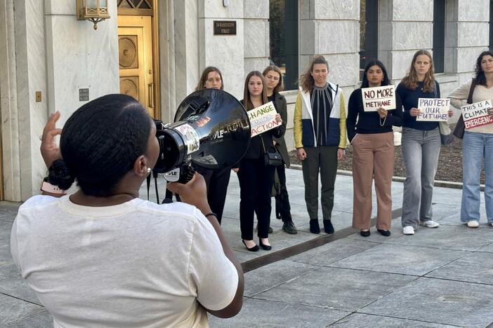 Sierra Club of Georgia community activist Keyanna Jones Moore leads a group of demonstrators outside Tuesday’s Georgia Public Service Commission meeting about Georgia Power’s controversial energy roadmap. Stanley Dunlap/Georgia Recorder.