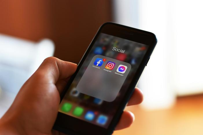 A Hand Holding a Cellphone. The Georgia Senate passed legislation to make doxxing a criminal offense in Georgia on Crossover Day, Thursday, March 6, 2025. Credit: Pexels