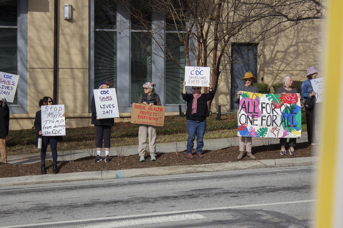 A demonstration at the Atlanta-based Centers for Disease Control and Prevention headquarters on Feb. 18, 2025, saw retired public health workers and others join to support current CDC employees as they left work to go home. Thousands have been terminated from agencies under the Department of Health and Human Services in recent days — a move that could threaten disease response.