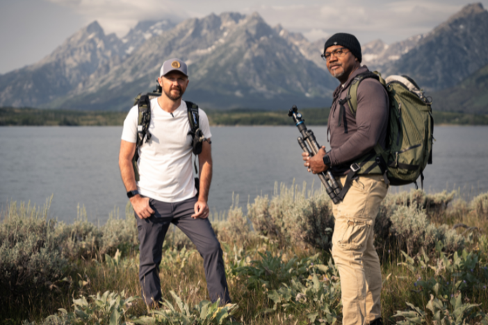 View Finders Season 3 hosts Chris Greer and Paul Daniel in front of a mountain