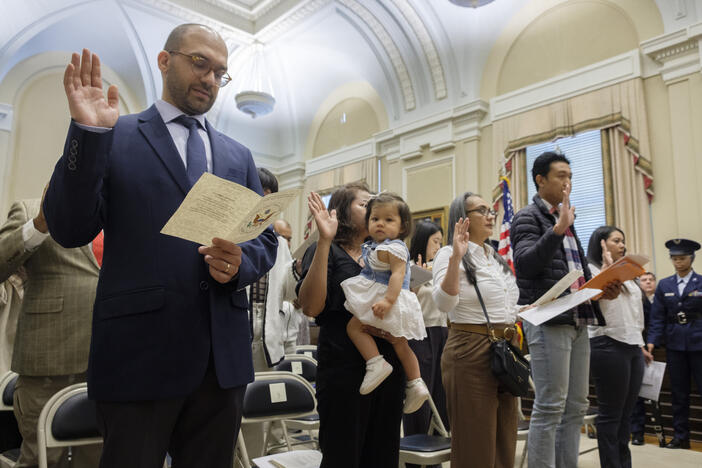 Twenty-two people originally from 15 different nations took the Oath of Allegiance to become United States citizens at the William Augustus Bootle Federal Courthouse in Macon Wednesday. The group was made up of students, mothers, fathers, engineers and even an entomologist. 