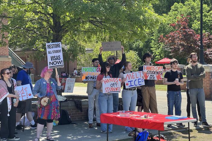 Protestors gather outside of Tate Student Center at the University of Georgia on April 16, 2025. Speakers at the rally called for an end to visa terminations for international students.
