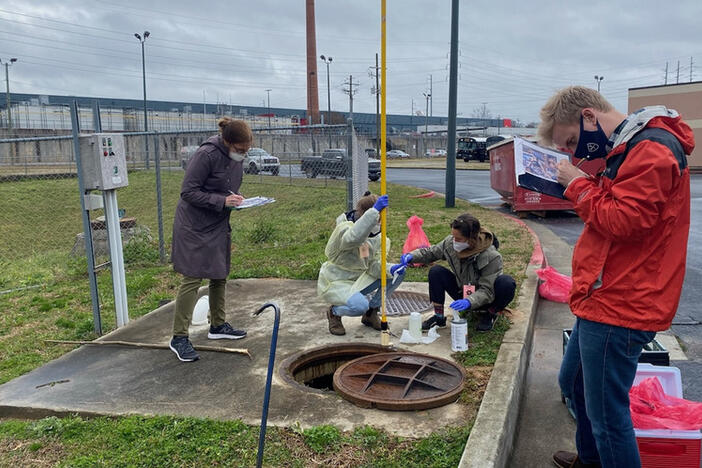 A group of people monitor wastewater in Fulton County, Georgia