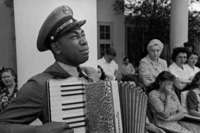 Graham W. Jackson SR. playing “Dvorak’s Goin Home” on his accordion as FDR’s flag draped casket passes.