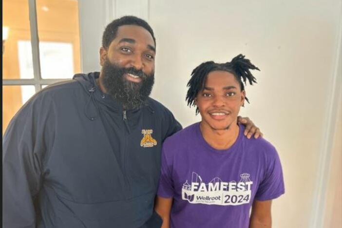 Life coach Ryan Mack and Anwar Hogan pose for a photo