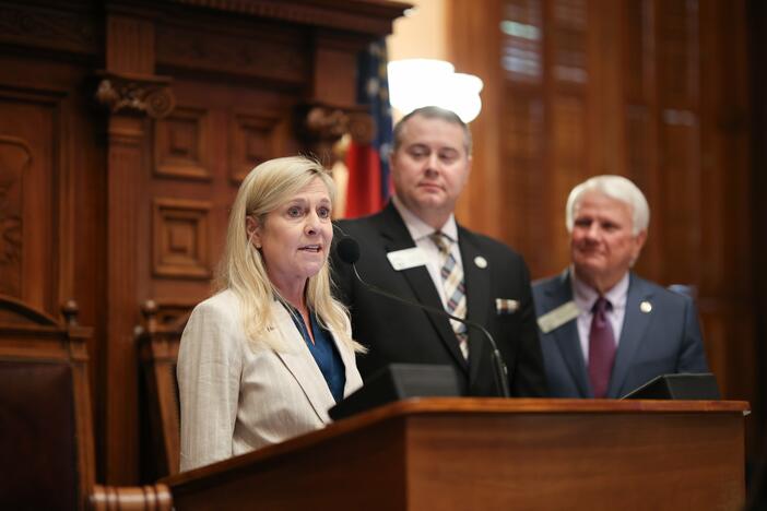 Georgia First Lady Marty Kemp (left) visited the House Chamber on Wednesday, April 2, 2025, with Department of Behavioral Health and Developmental Disabilities Commissioner Kevin Tanner (right) to discuss the 988 mental health crisis hotline. Credit: Georgia House of Representatives