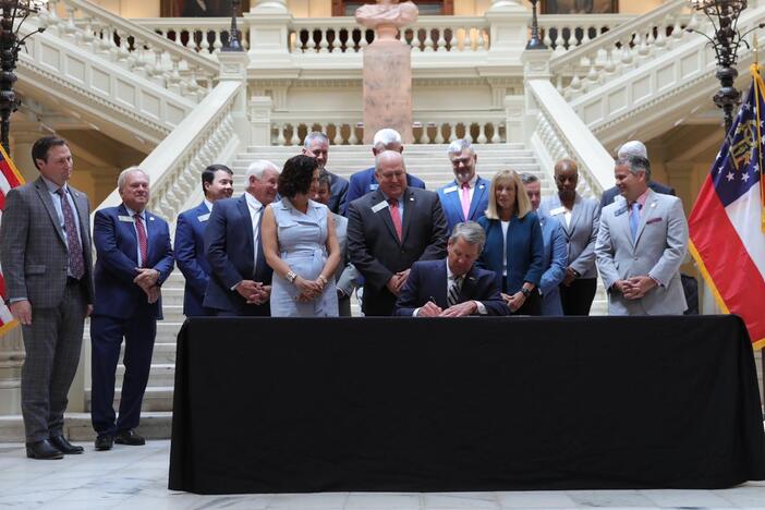 Kemp signs the bills 